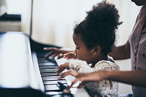 Girl learning Piano